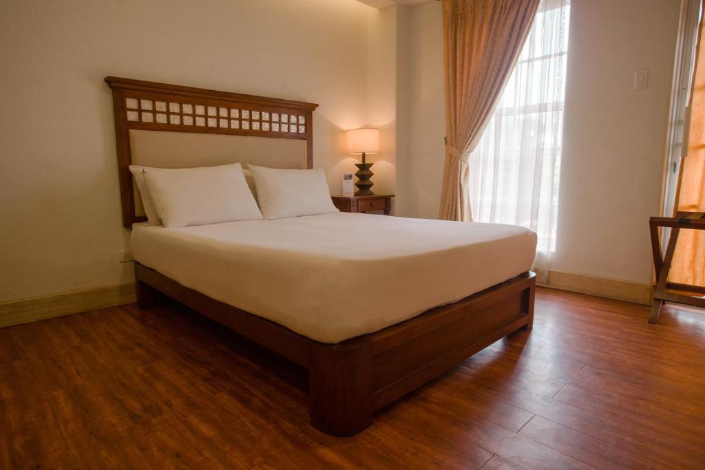 Postel nebo postele na pokoji v ubytování Hotel Emilia