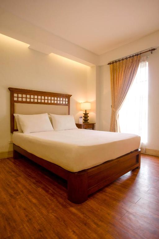 Postel nebo postele na pokoji v ubytování Hotel Emilia