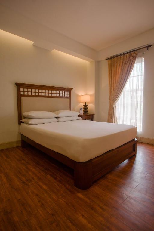 Postel nebo postele na pokoji v ubytování Hotel Emilia