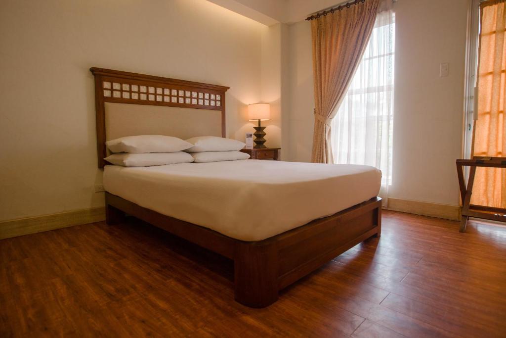 Postel nebo postele na pokoji v ubytování Hotel Emilia