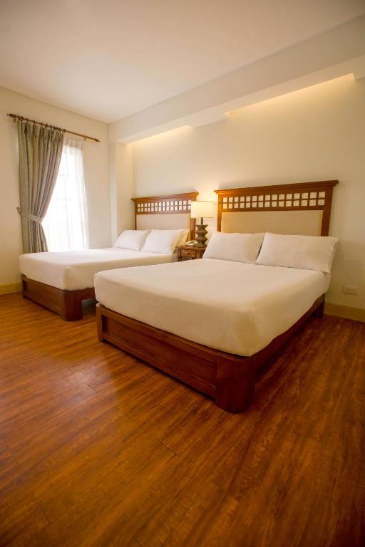 Postel nebo postele na pokoji v ubytování Hotel Emilia