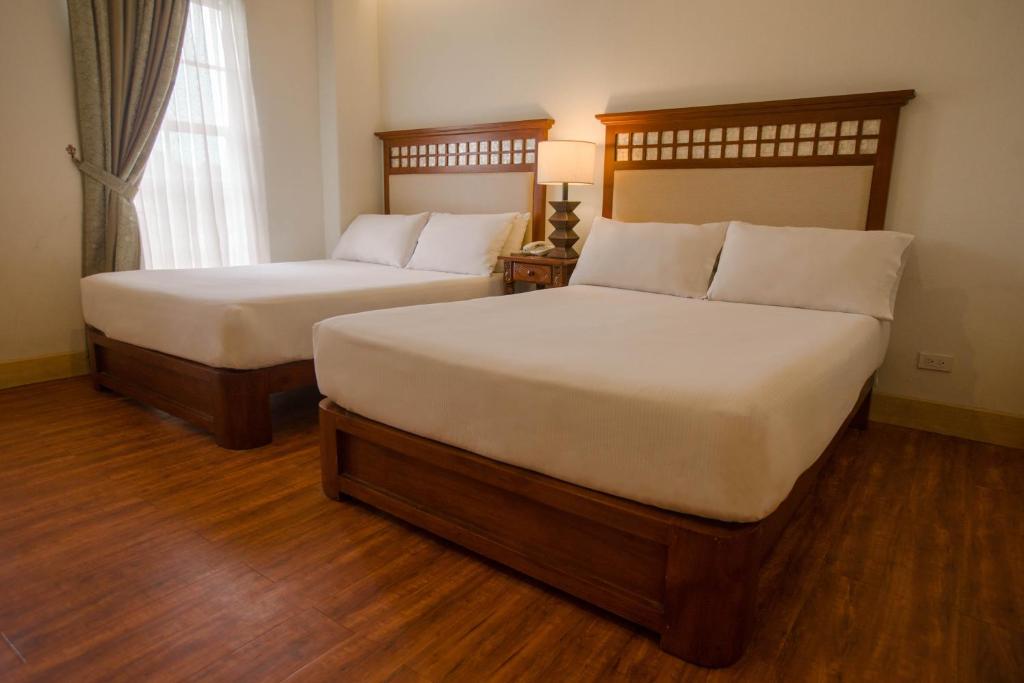 Postel nebo postele na pokoji v ubytování Hotel Emilia