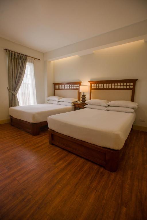Postel nebo postele na pokoji v ubytování Hotel Emilia