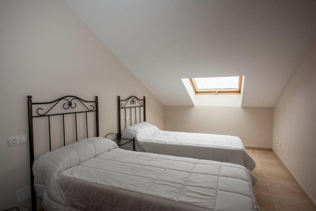 A bed or beds in a room at viviendas de uso turístico FINISTERRAE PLAYA