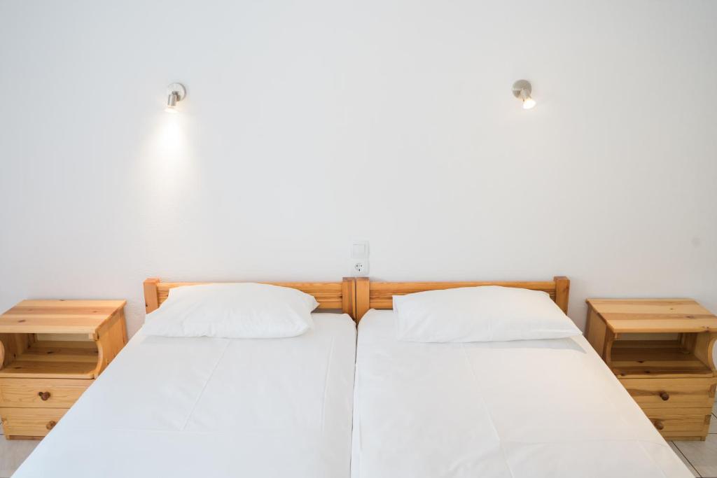 Postel nebo postele na pokoji v ubytování Afroditi Pansion