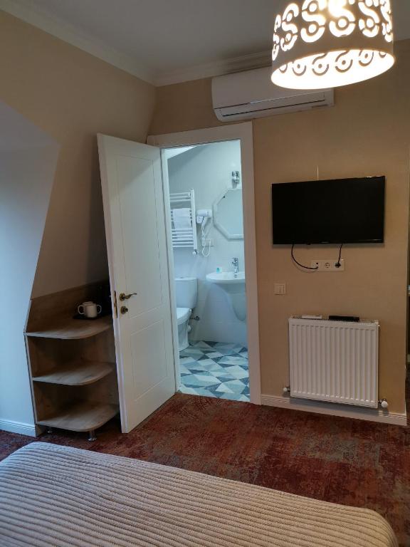 TV a/nebo společenská místnost v ubytování Boutique Hotel BelleVue