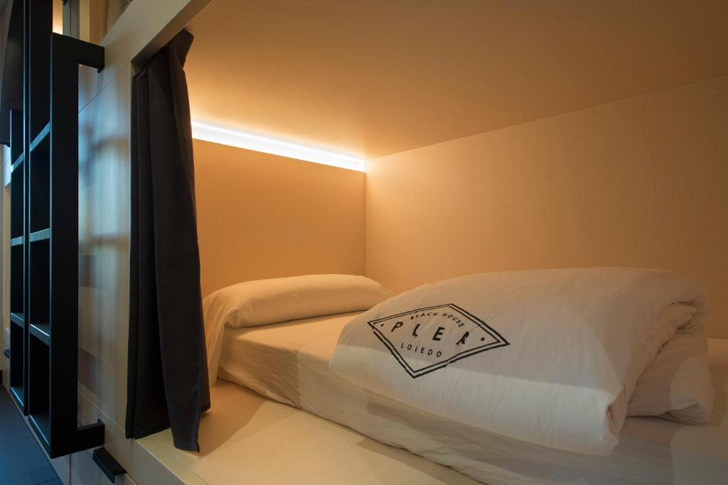 Postel nebo postele na pokoji v ubytování Plea Beach House
