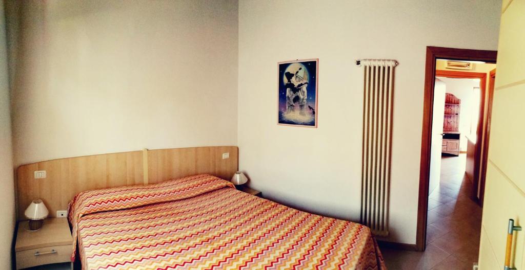 A bed or beds in a room at Residenza Cristina