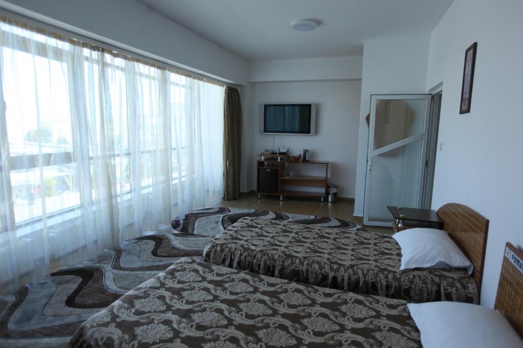 Postel nebo postele na pokoji v ubytování Motel Nordiana