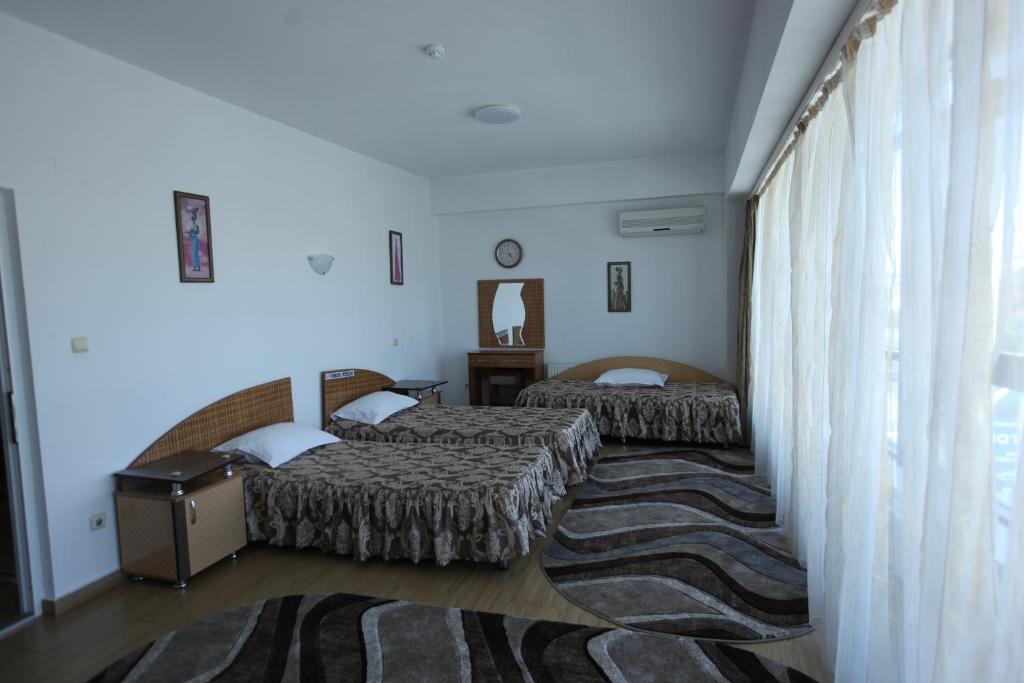 Postel nebo postele na pokoji v ubytování Motel Nordiana