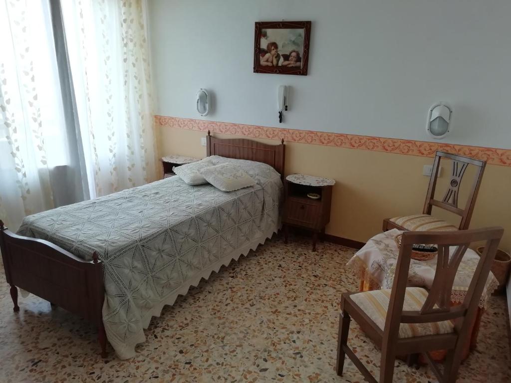Postel nebo postele na pokoji v ubytování Albergo La Torre