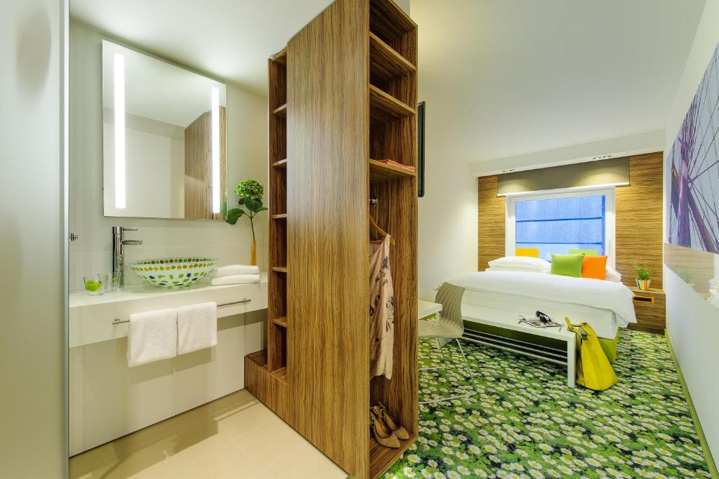Łóżko lub łóżka w pokoju w obiekcie Ibis Styles Wien City