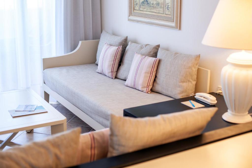 A seating area at Grupotel Macarella Suites & Spa