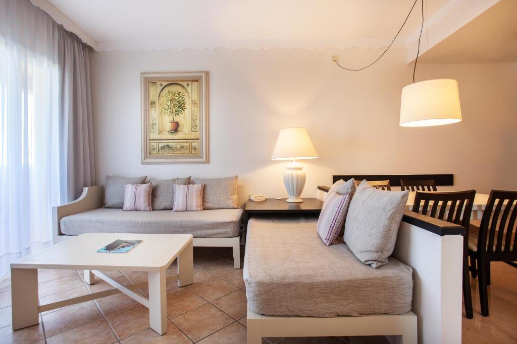 A seating area at Grupotel Macarella Suites & Spa