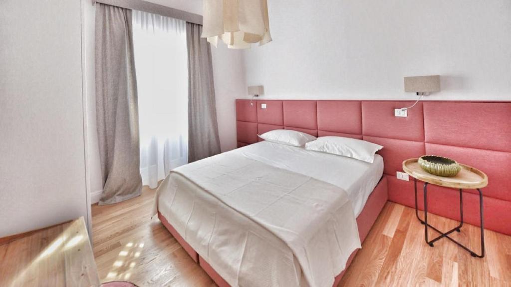 Postel nebo postele na pokoji v ubytování Domus D'Angelo B&B