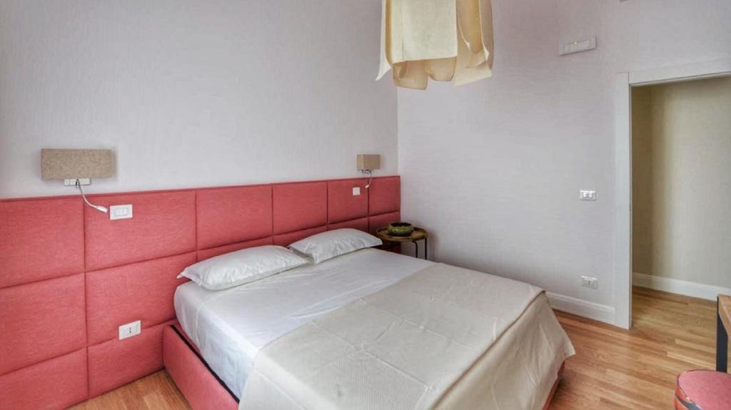 Postel nebo postele na pokoji v ubytování Domus D'Angelo B&B