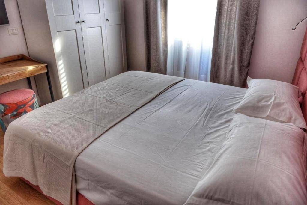 Postel nebo postele na pokoji v ubytování Domus D'Angelo B&B