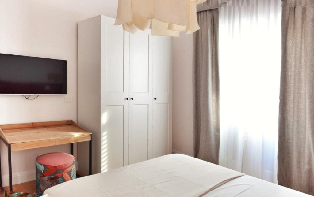 Postel nebo postele na pokoji v ubytování Domus D'Angelo B&B