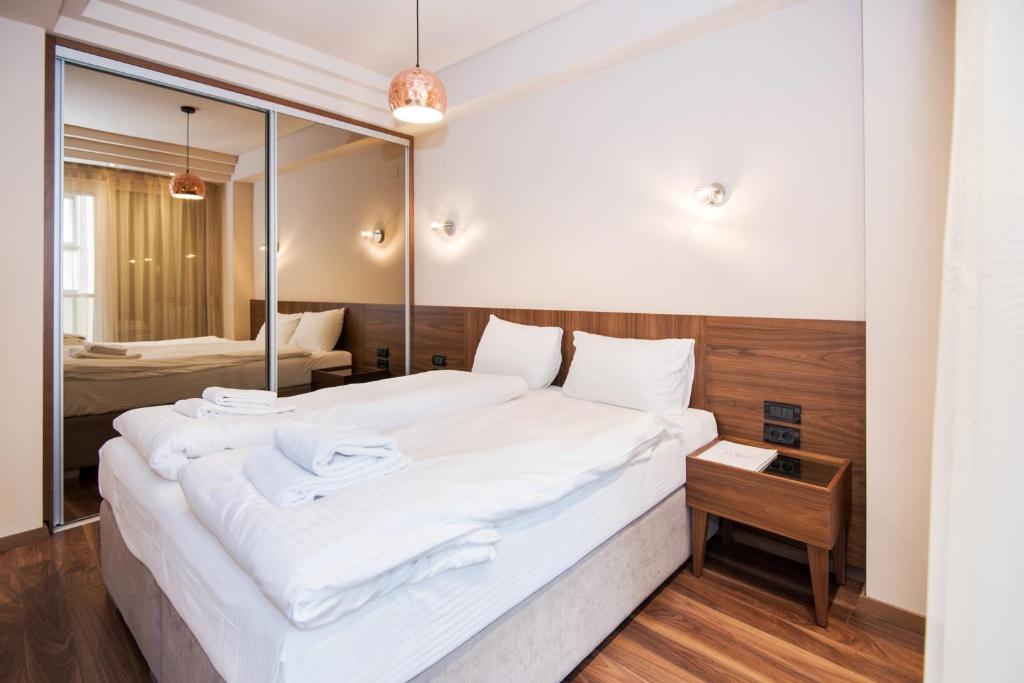 Postel nebo postele na pokoji v ubytování Hotel Vlaho