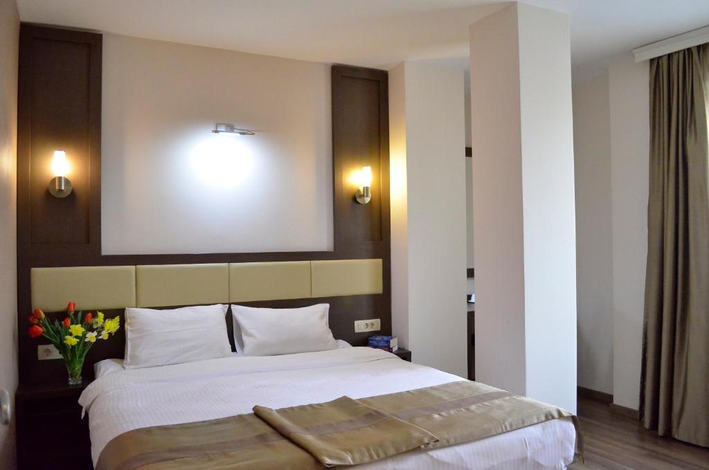 Postel nebo postele na pokoji v ubytování Hotel Vlaho