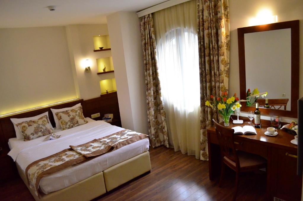 Postel nebo postele na pokoji v ubytování Hotel Vlaho