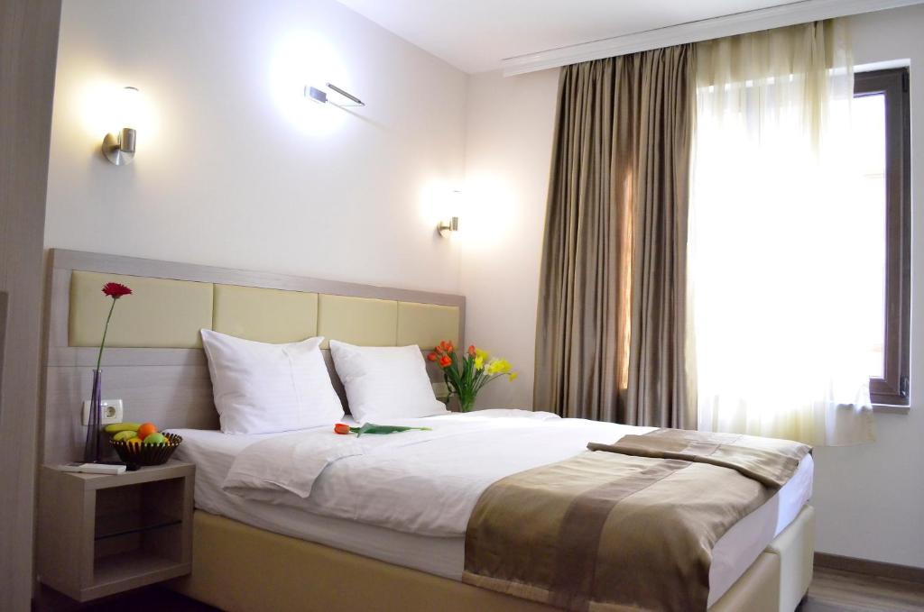 Postel nebo postele na pokoji v ubytování Hotel Vlaho