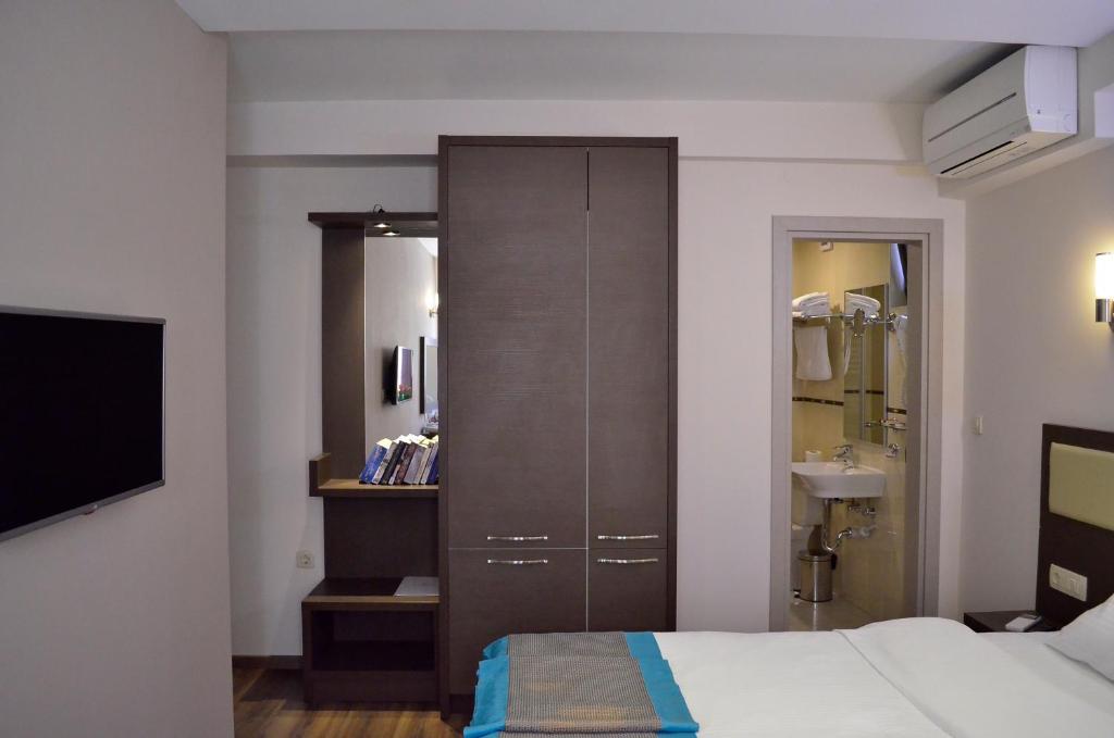 Postel nebo postele na pokoji v ubytování Hotel Vlaho