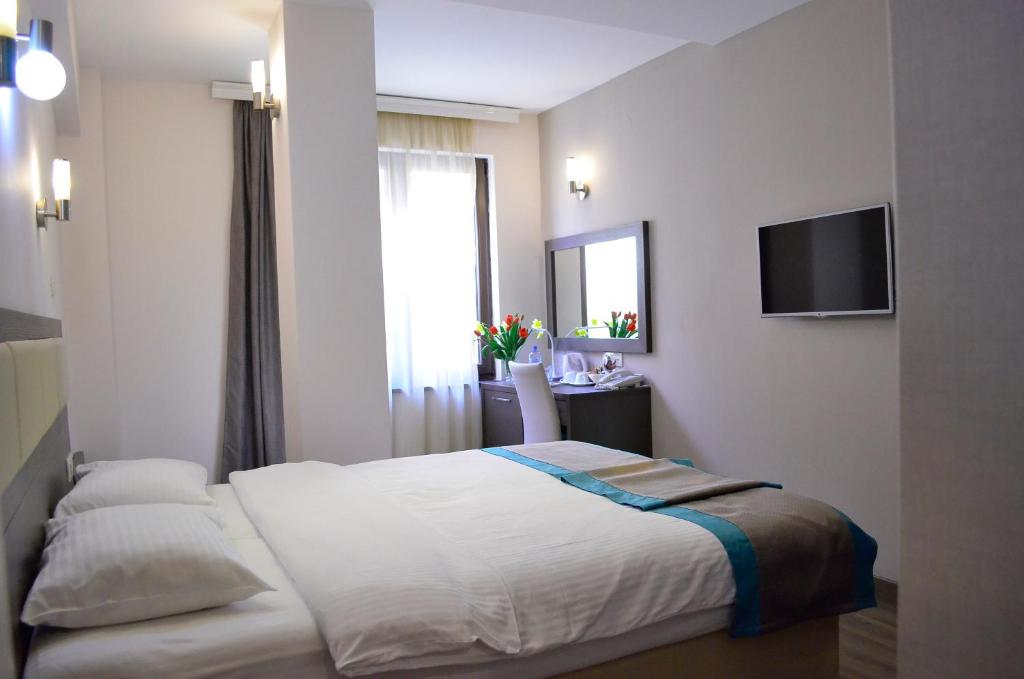 Postel nebo postele na pokoji v ubytování Hotel Vlaho