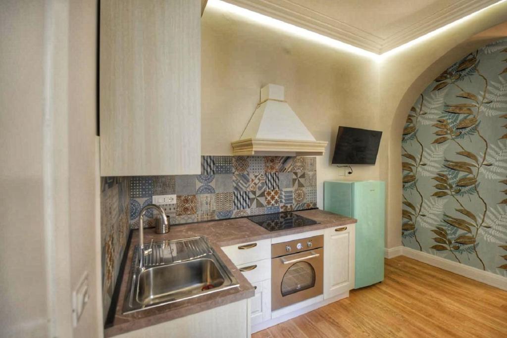 Kuchyň nebo kuchyňský kout v ubytování Domus D'Angelo B&B