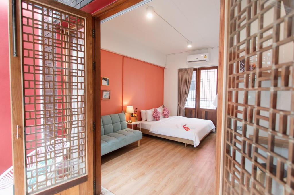 Postel nebo postele na pokoji v ubytování House Of Papa Bangkok Siam