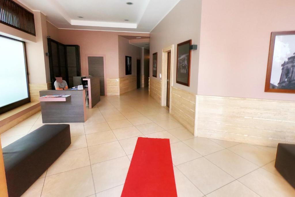 Telewizja i/lub zestaw kina domowego w obiekcie La Preziosa Apartment