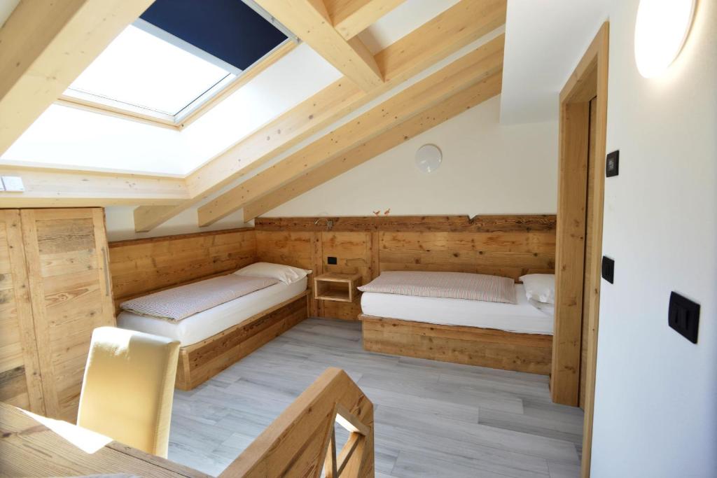 Postel nebo postele na pokoji v ubytování Wellness Hotel Dolomia