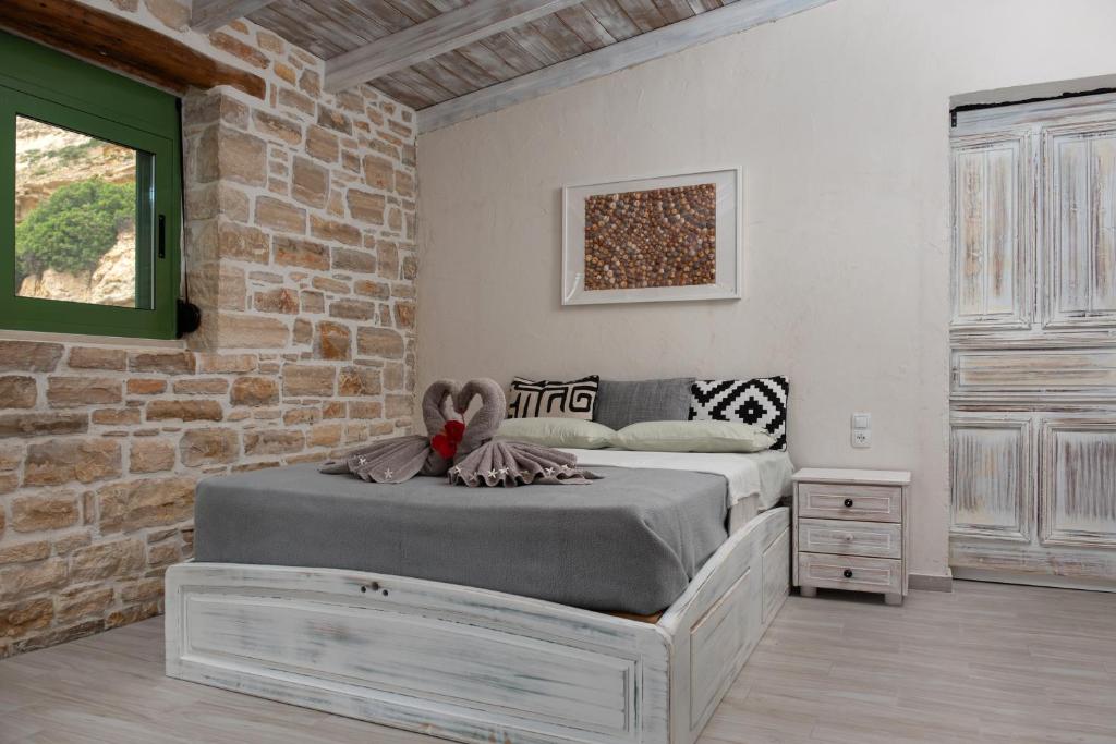 Postel nebo postele na pokoji v ubytování Apartments and Studios Xenophon