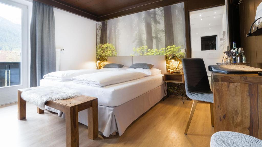 Postel nebo postele na pokoji v ubytování Boutique Hotel Olympia