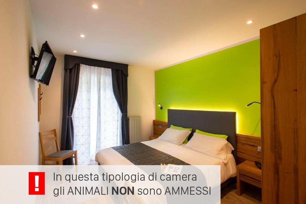 Postel nebo postele na pokoji v ubytování Hotel Angelo