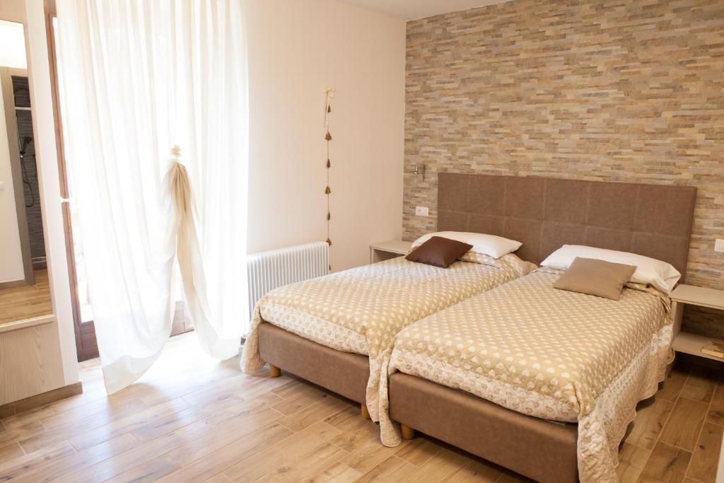 Postel nebo postele na pokoji v ubytování Hotel Wanda