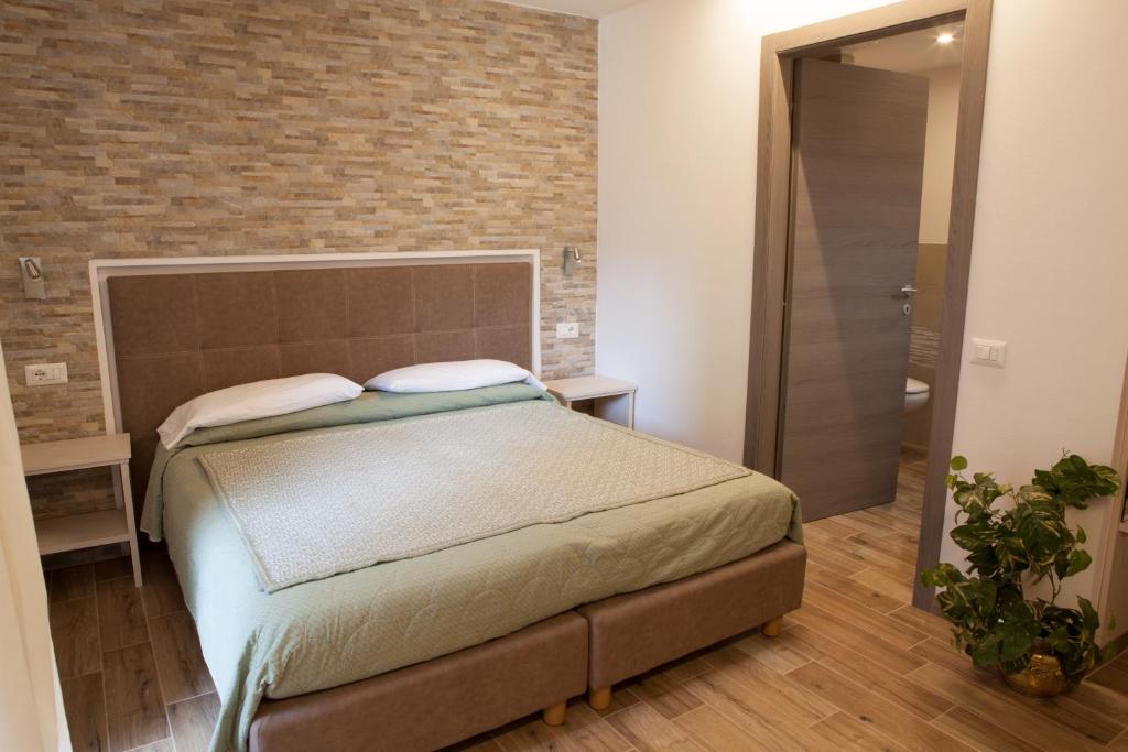Postel nebo postele na pokoji v ubytování Hotel Wanda