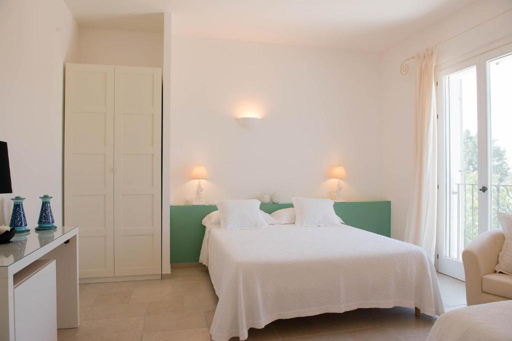 Postel nebo postele na pokoji v ubytování B&B Casale Savini
