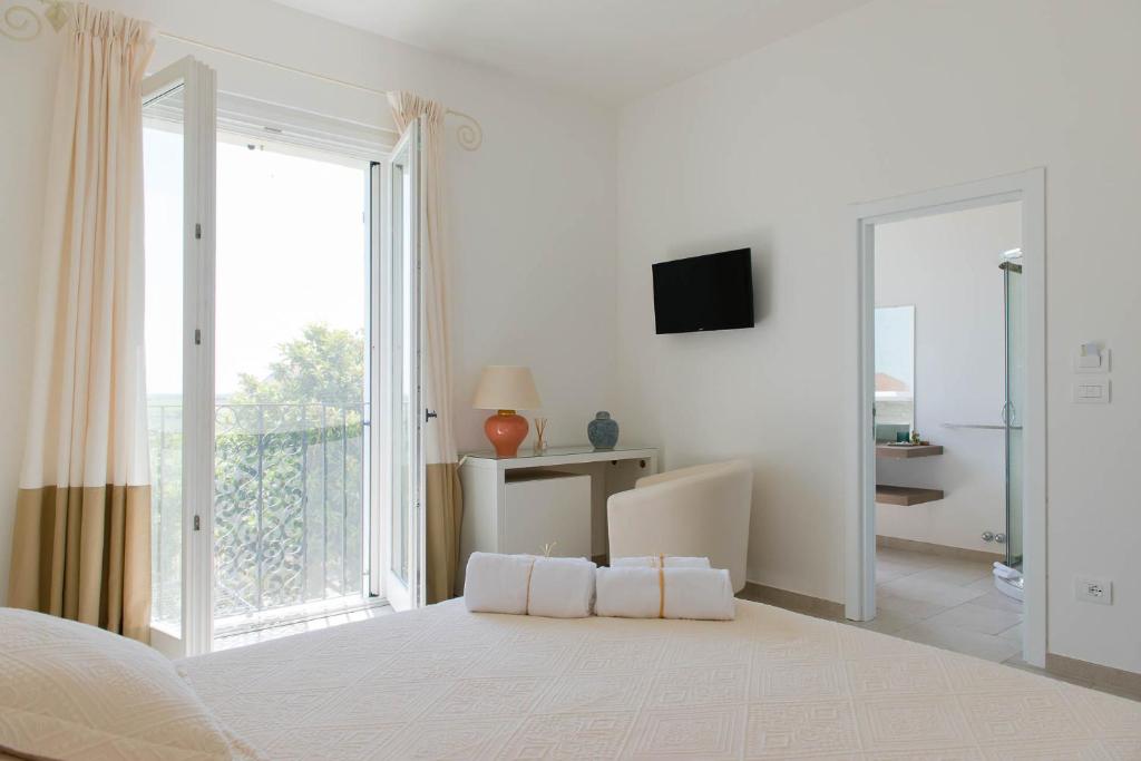 Postel nebo postele na pokoji v ubytování B&B Casale Savini