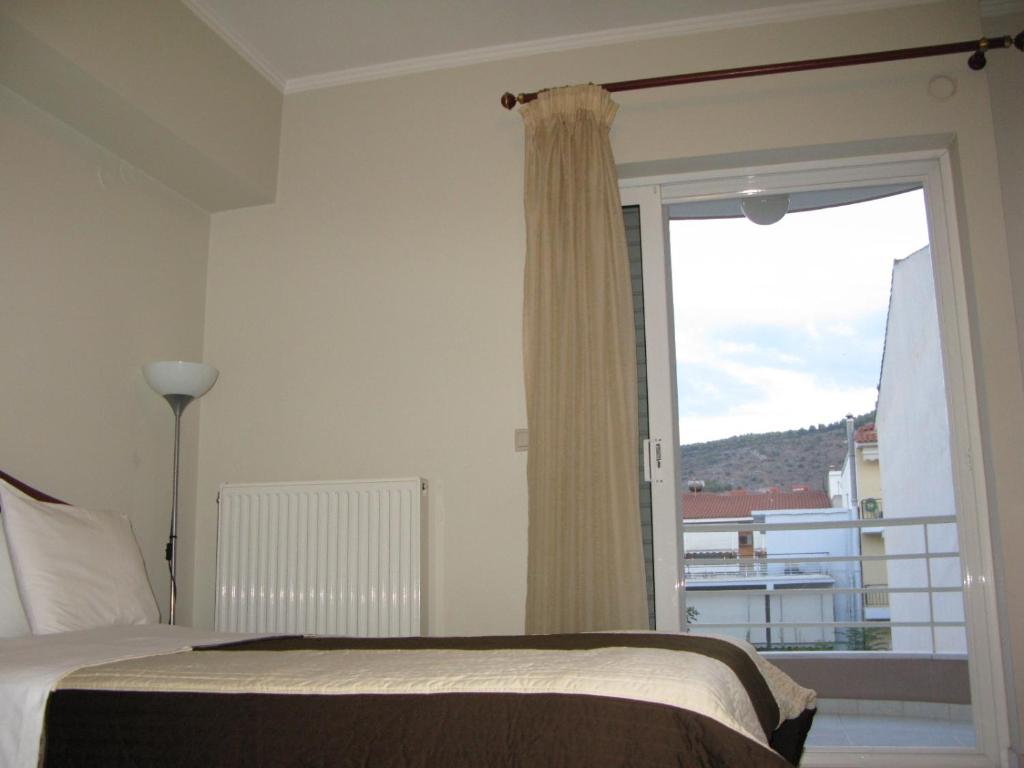 Postel nebo postele na pokoji v ubytování ALEXANDER Rooms