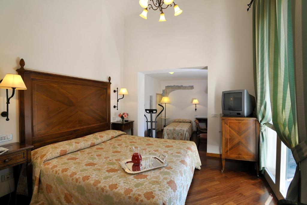 Postel nebo postele na pokoji v ubytování Hotel Fortuna