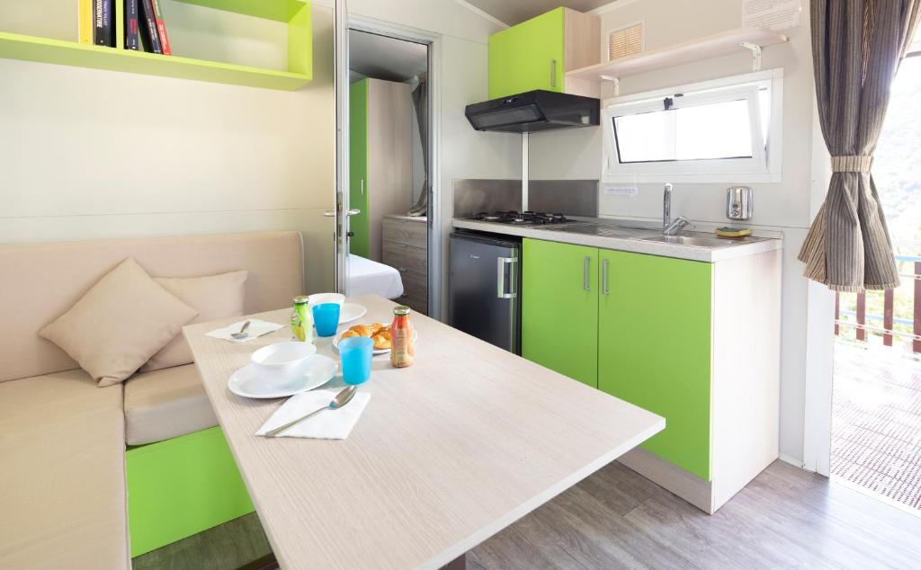 Kuchyň nebo kuchyňský kout v ubytování Camping Genova Est