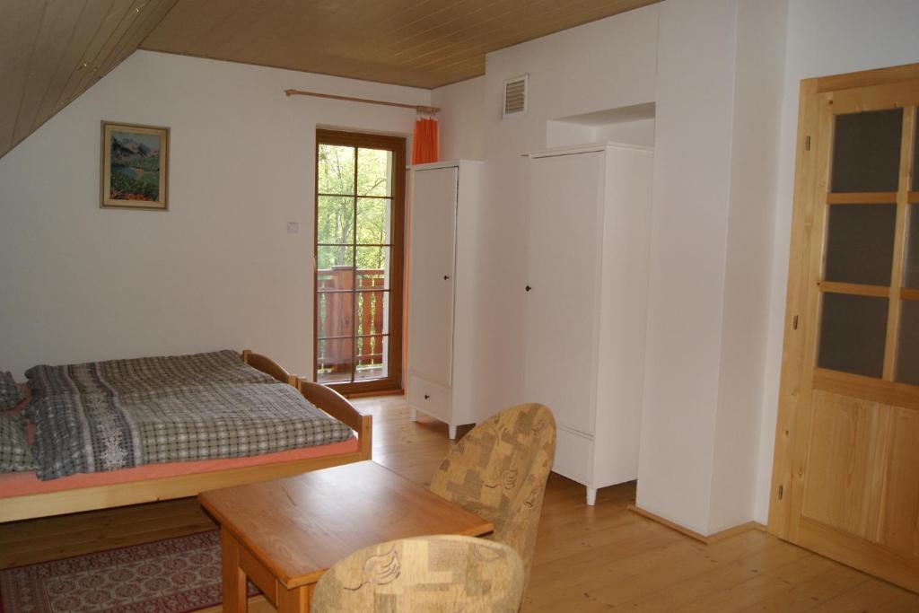 Postel nebo postele na pokoji v ubytování Chalet Horní Orlice