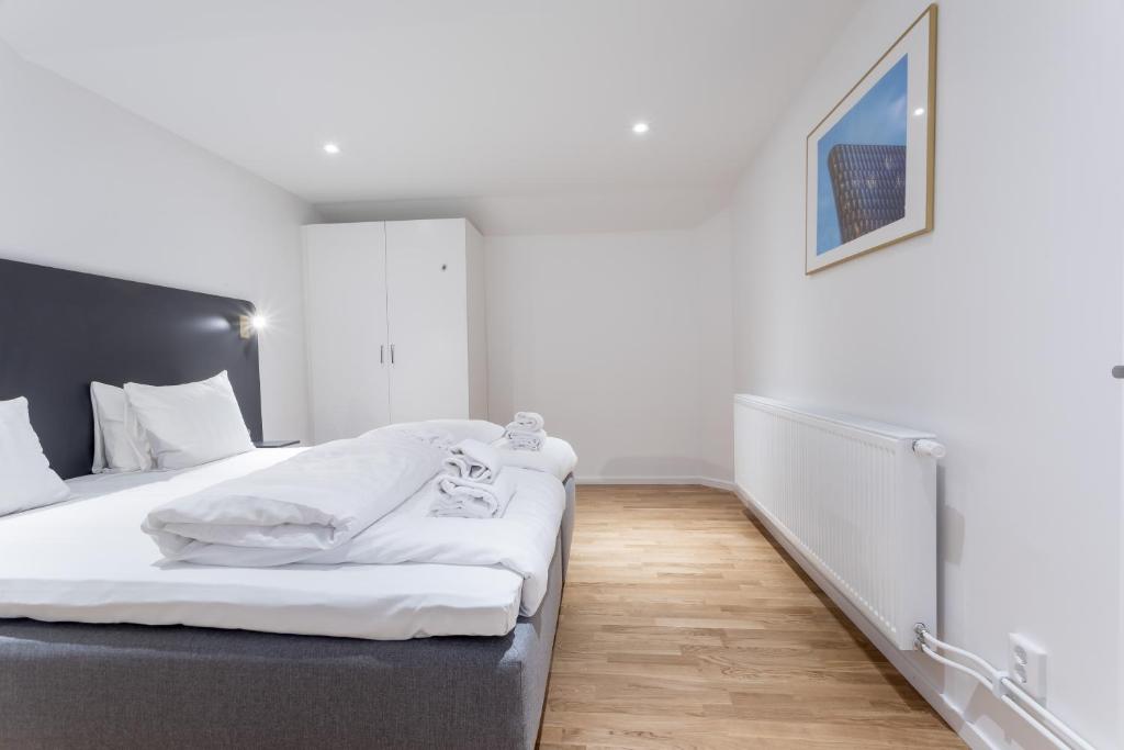 Postel nebo postele na pokoji v ubytování ApartDirect Sundbyberg