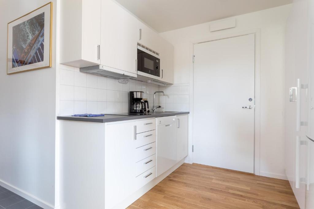 Kuchyň nebo kuchyňský kout v ubytování ApartDirect Sundbyberg
