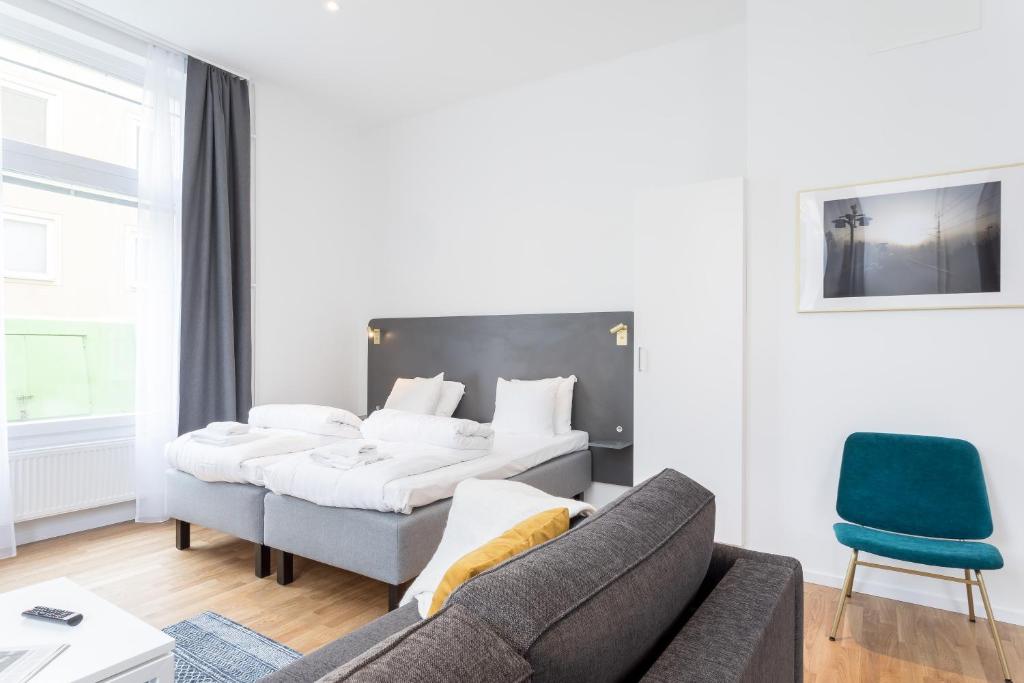 Postel nebo postele na pokoji v ubytování ApartDirect Sundbyberg