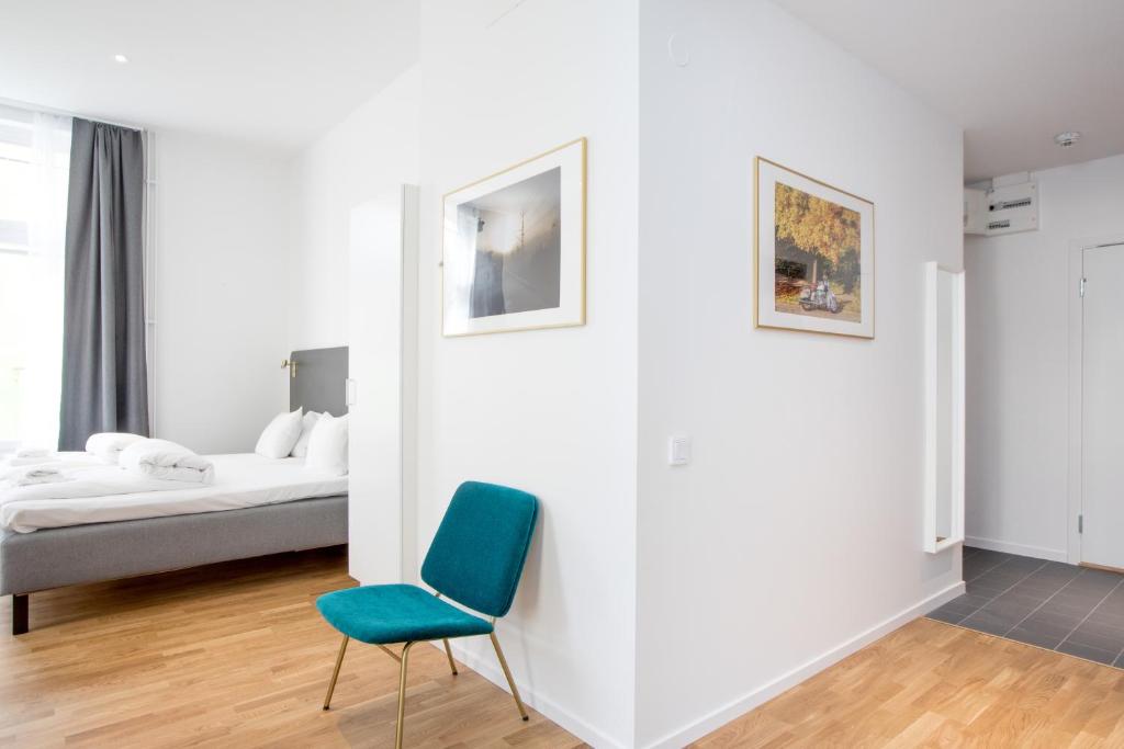 Postel nebo postele na pokoji v ubytování ApartDirect Sundbyberg
