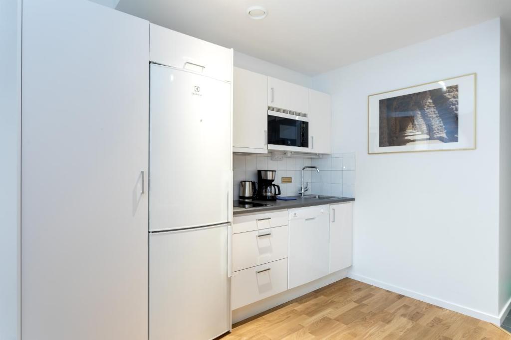 Kuchyň nebo kuchyňský kout v ubytování ApartDirect Sundbyberg