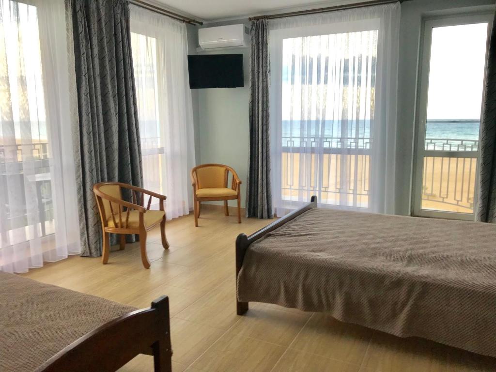 Postel nebo postele na pokoji v ubytování Hotel Golden Beach