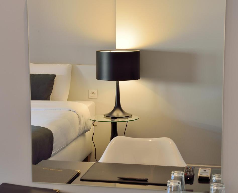 Postel nebo postele na pokoji v ubytování Hotel Retro